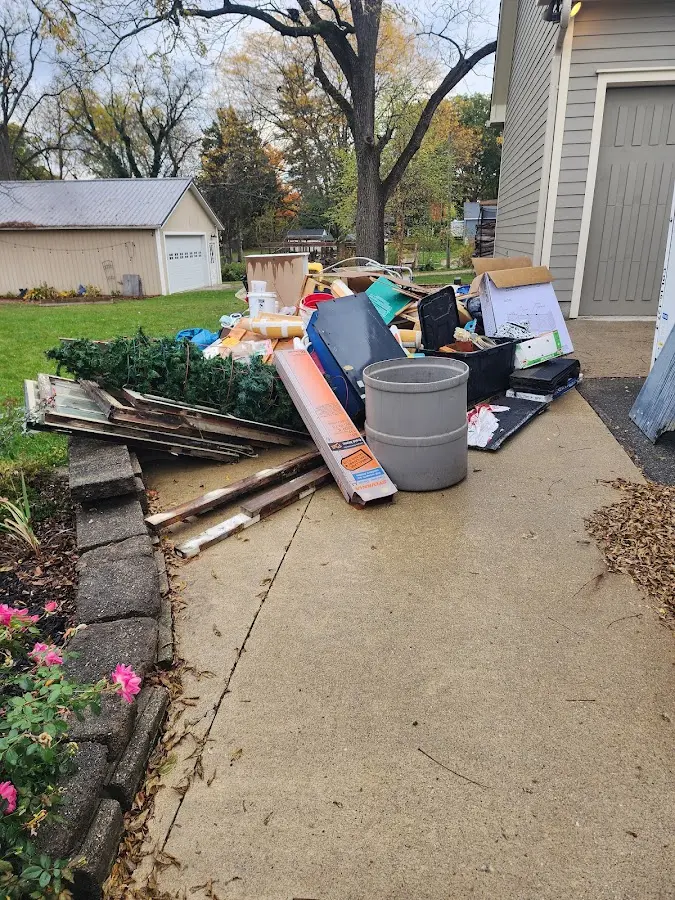 Dumpster being loaded with debris for Commercial Dumpster Rental in Denham Springs
